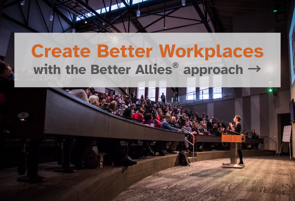 Photo of Karen Catlin giving a talk at the University of Nebraska Innovation Center auditorium. A large crowd is seated in the risers surrounding the stage. There's large text overlayed on the image that reads Create Better Workplaces with the Better Allies approach. There's an arrow welcoming you to click on the image to learn more.